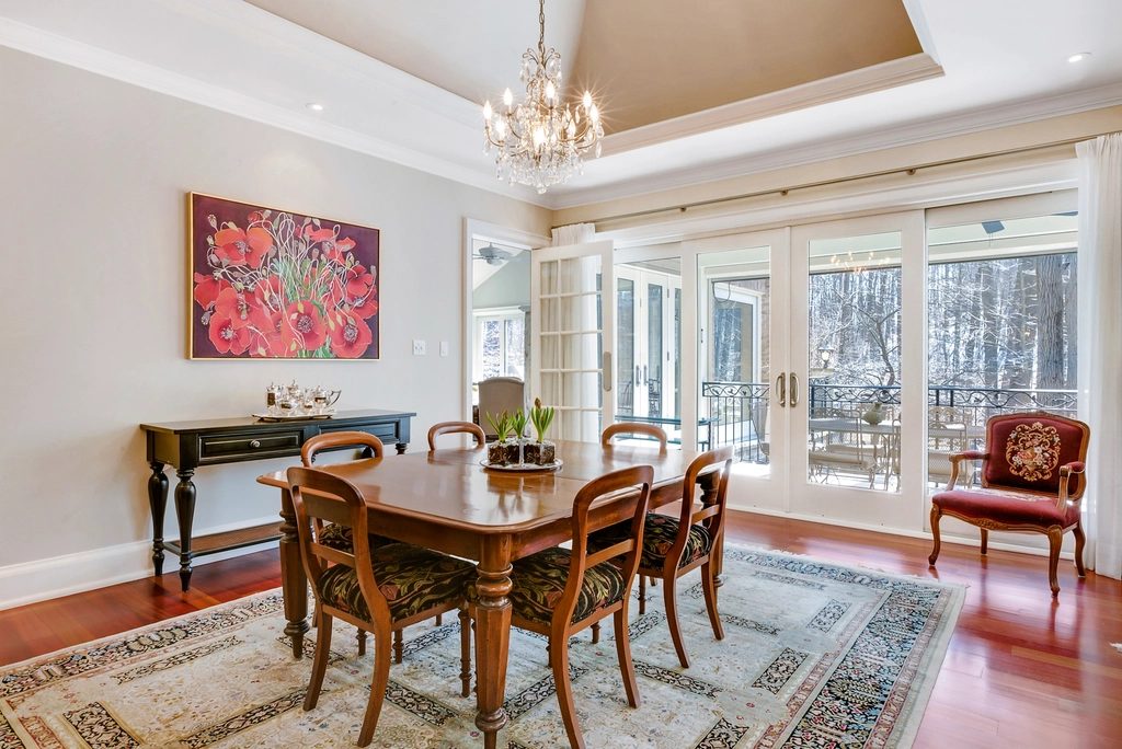 Elegant dining room furnished with a wooden table and chairs